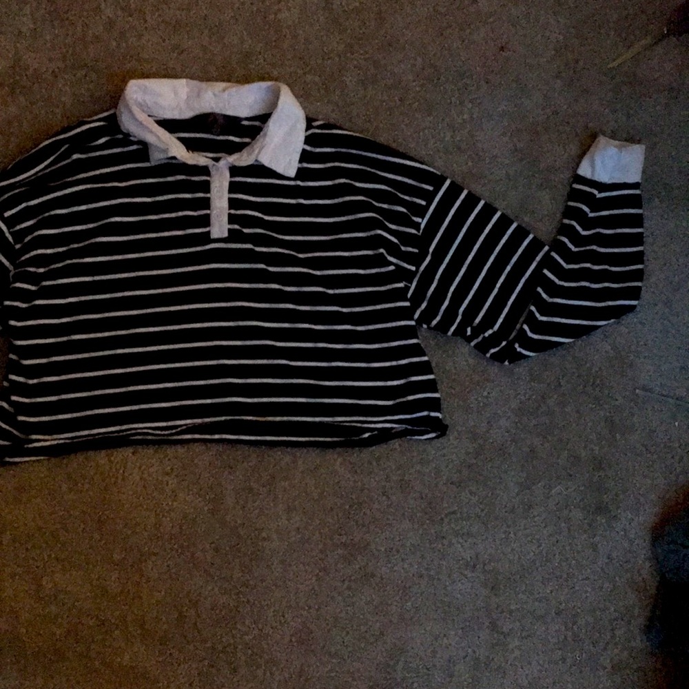 Black and white striped, cropped, collared, long sleeve tee.